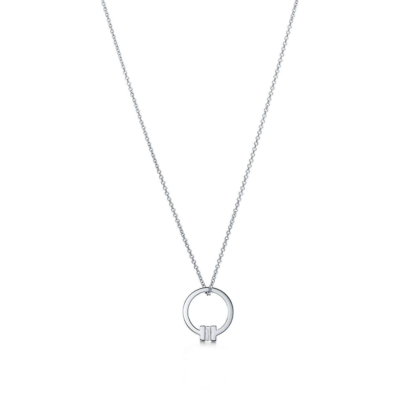 TIFFANY T PENDANT IN 18K WHITE GOLD WITH A BAGUETTE DIAMOND